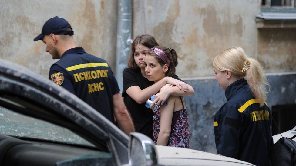 Lviv residents after rocket strike on apartment block