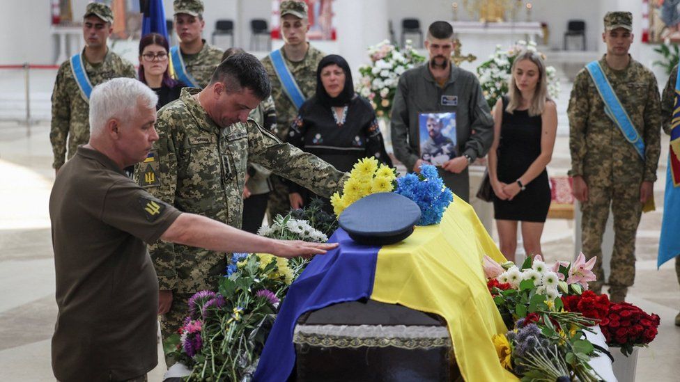 Ukraine's Air Force Commander Mykola Oleshchuk (2nd left) was among the mourners