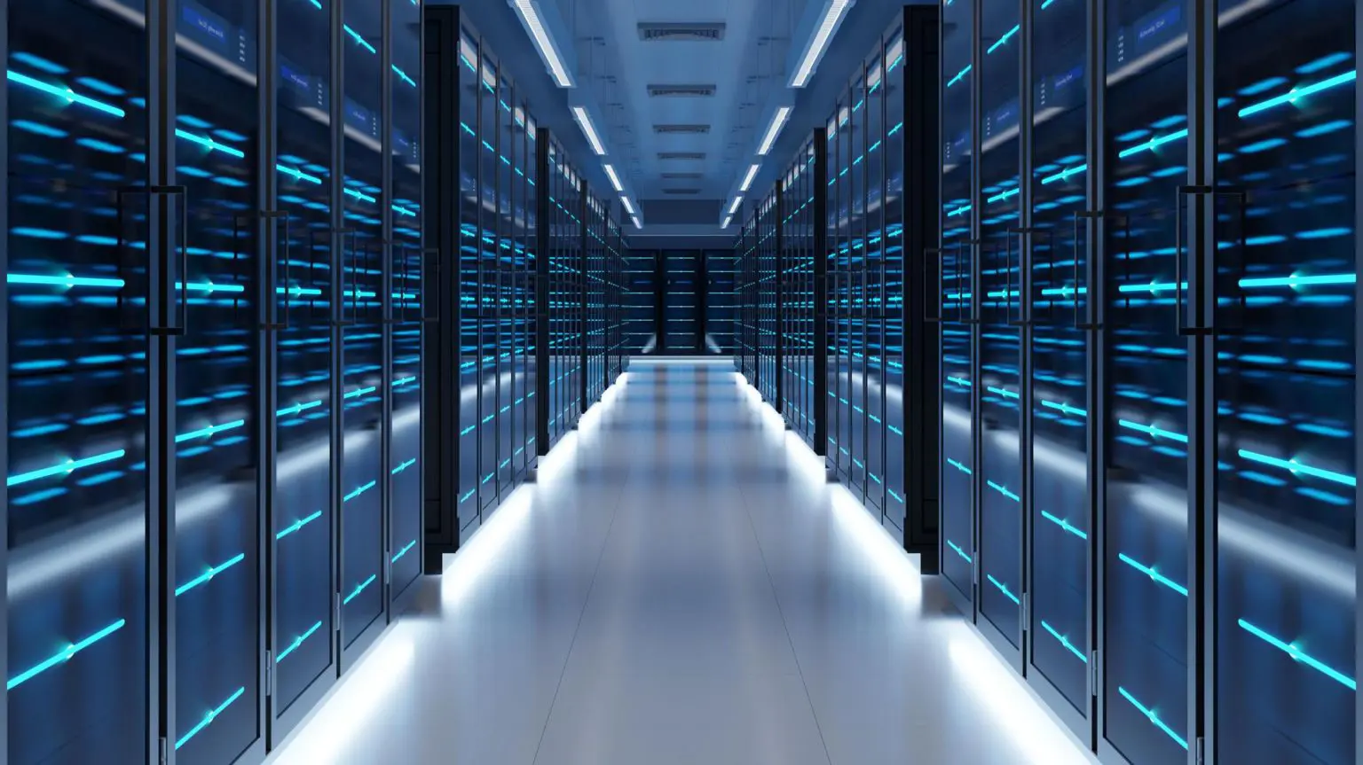 В Великобритании каждый третий использует ИИ для эмоциональной поддержки и общения 1 Вид на коридор центра обработки данных, вдоль которого расположены темные шкафы, освещенные светильниками. Атмосфера зловещая.