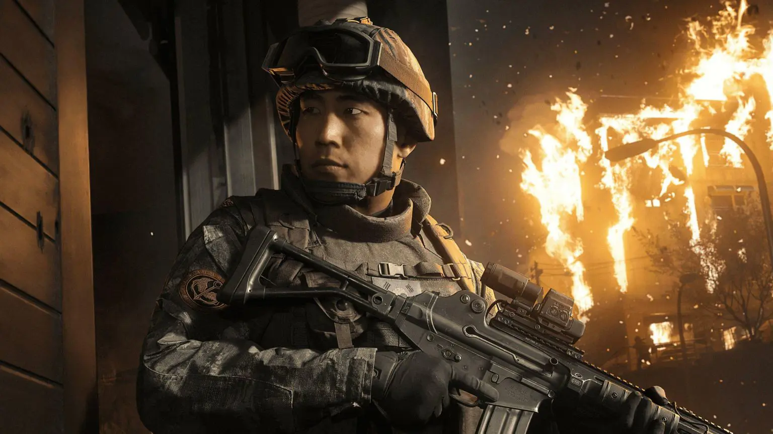 «Спорное» место действия вторжения в Северную Корею в следующей игре Call of Duty. 1 Скриншот из игры, на котором изображен корейский солдат мужского пола с оружием в руках, а позади него горит здание.